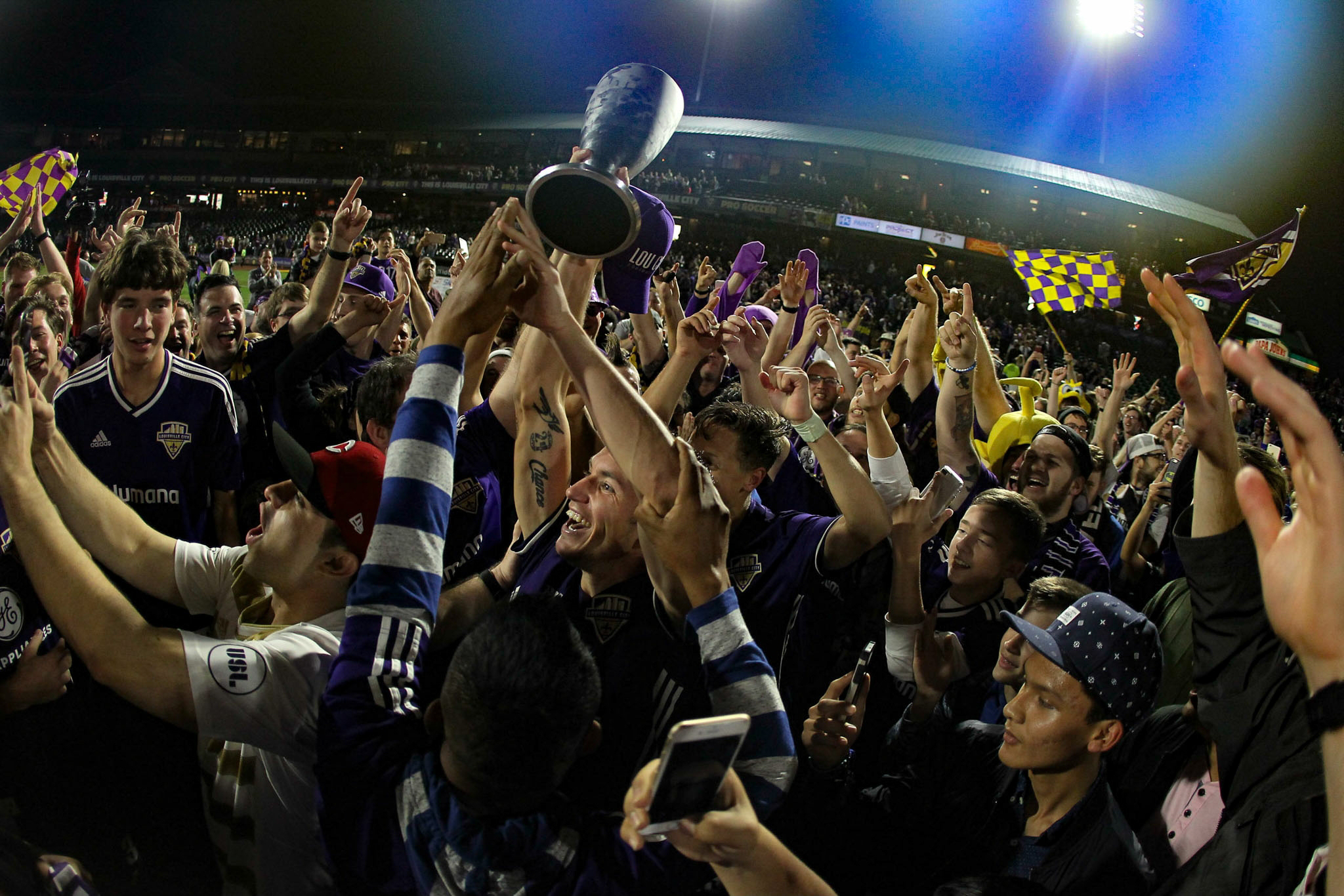 Coopers and Louisville City lifting the USL trophy