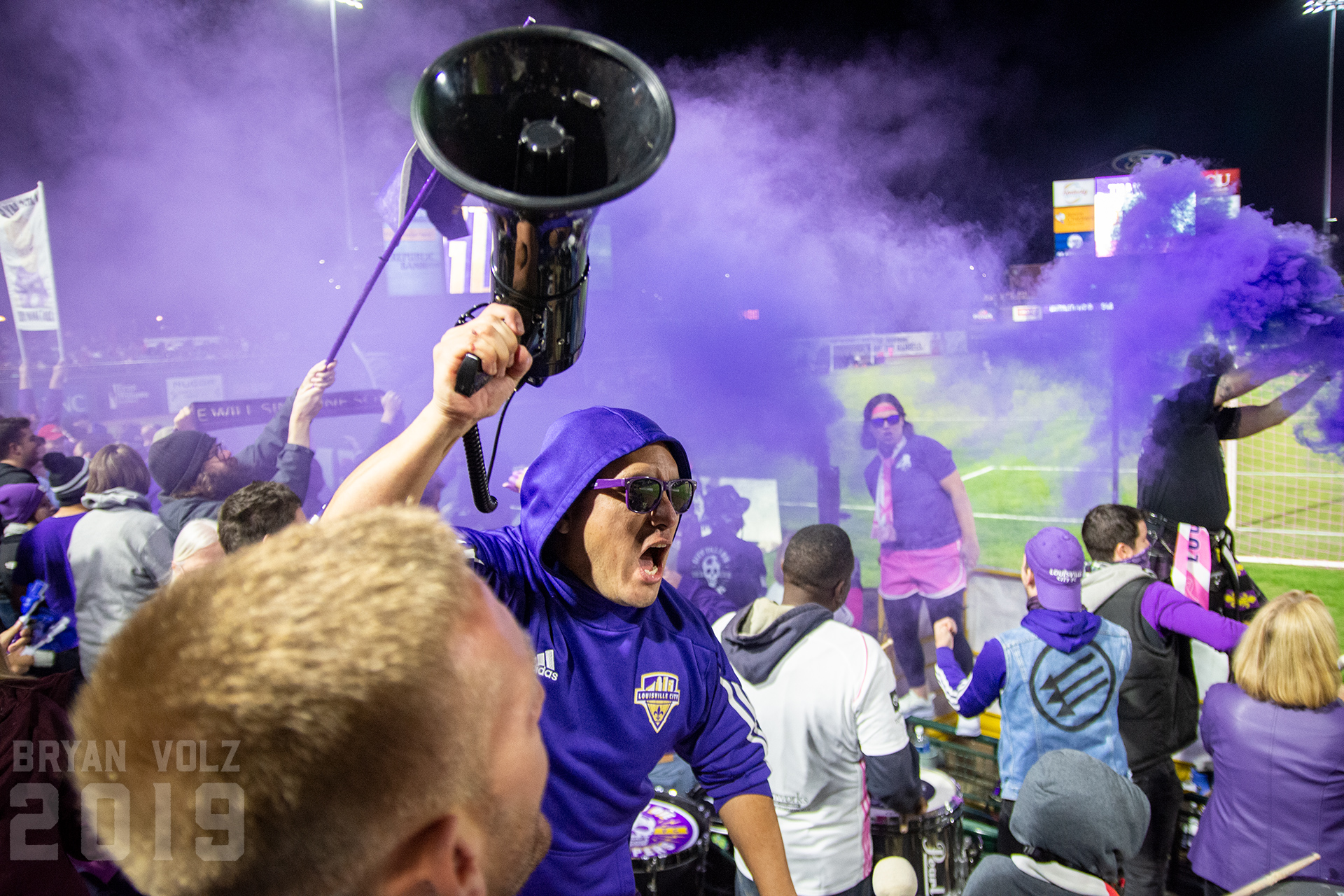 Louisville Coopers celebrating a goal with purple smoke grenades